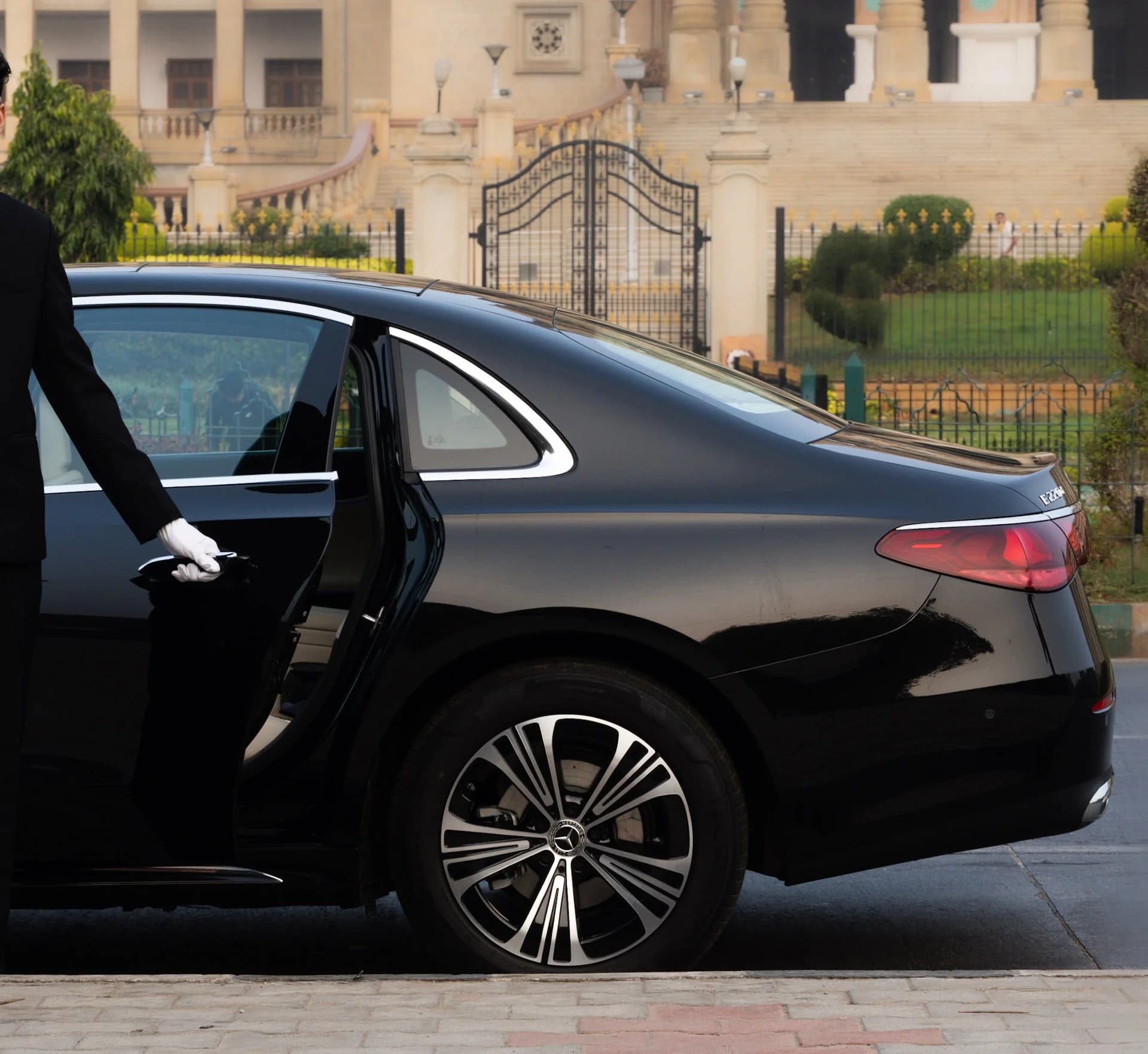 Chauffeur driven luxury car for hire in Bangalore — white glove door service