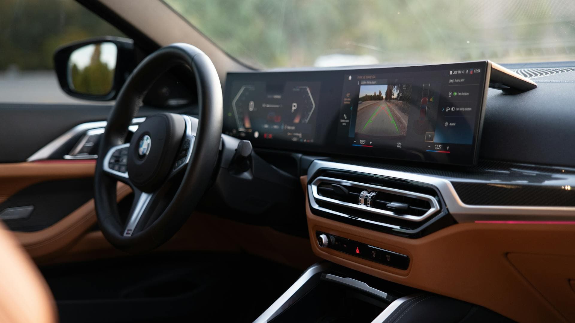 BMW 530 Li M Sport interior with curved iDrive display — premium chauffeur-driven car rental in Bangalore